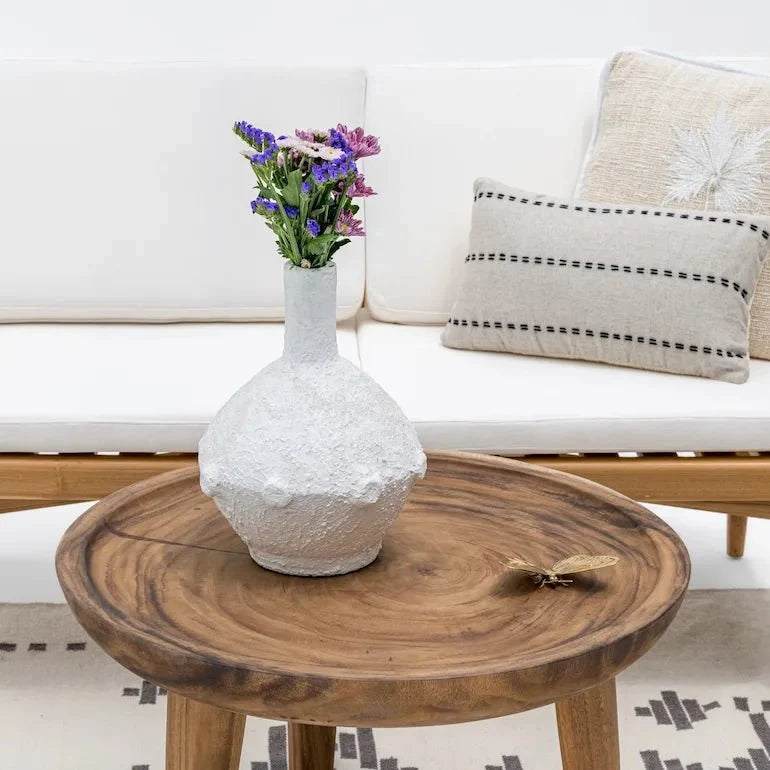 Coffee table in Dubai living room comparing wood, rattan and concrete