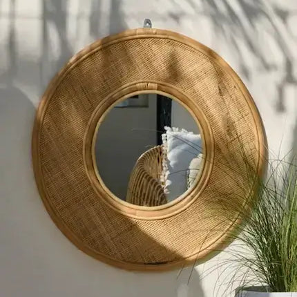 Rattan wall mirror in bohemian home decor living room