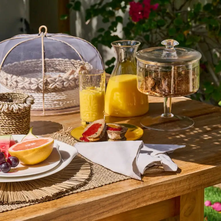 Table runner and placemat set on a styled dining table - table setting