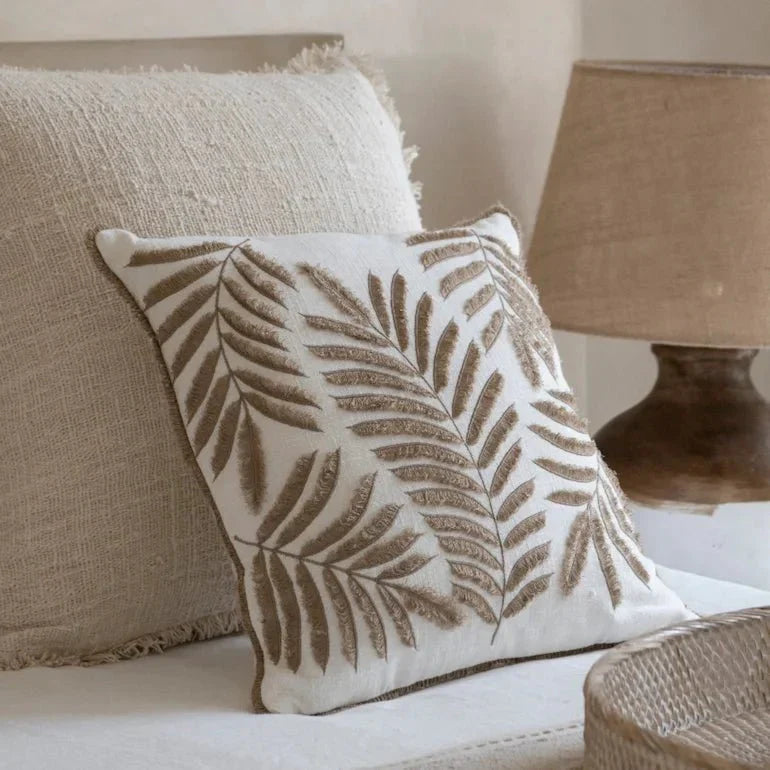 Linen and cotton cushions on a neutral sofa - cushion styling Dubai homes