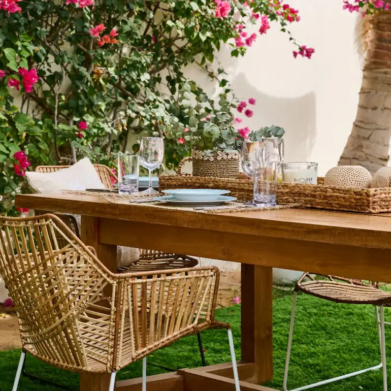 Outdoor sofa and dining table on a styled Dubai terrace - summer living