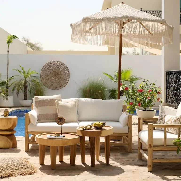 Rattan and wooden furniture in a bright Dubai living room by the water