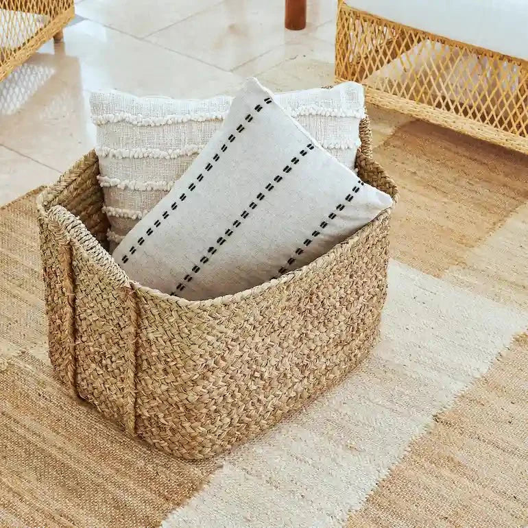 Woven storage baskets styled in a Dubai living room