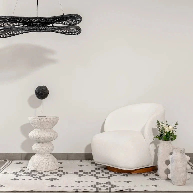 Reading corner in Dubai home with hanging lamp and comfortable armchair