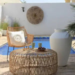 Boho rattan lounge chair and round table outdoor Dubai