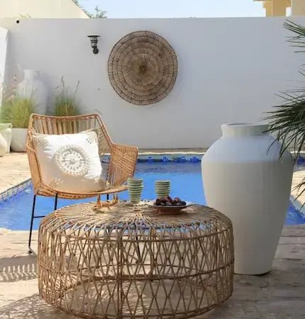 Boho rattan lounge chair and round table outdoor Dubai