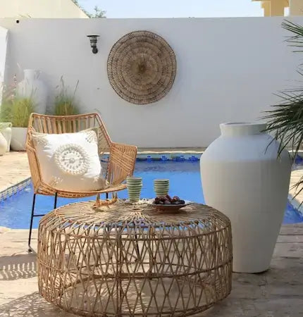 Boho rattan lounge chair and round table outdoor Dubai