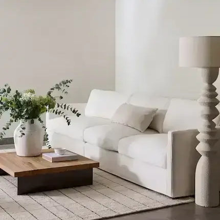 Modern living room with white sofa and wooden coffee table