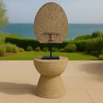 Decorative mask on a stand with a scenic background