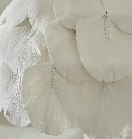 Handcrafted natural pendant light with layered textured panels