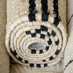 Eco-friendly black striped jute rug with a textured woven finish - Home and Soul