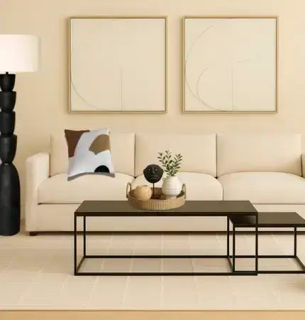 Modern living room with a beige sofa, black coffee table