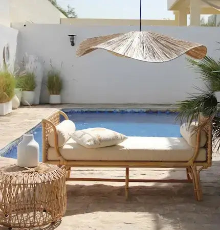 Organic rattan daybed and statement pendant light