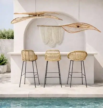 Outdoor bar setting with rattan bar stools and woven pendant lights by the pool