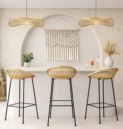 Rattan bar stools and woven rattan pendant lights in a boho outdoor garden