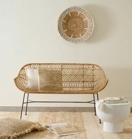 Rattan bench with woven wall decor and jute rug home decor sale