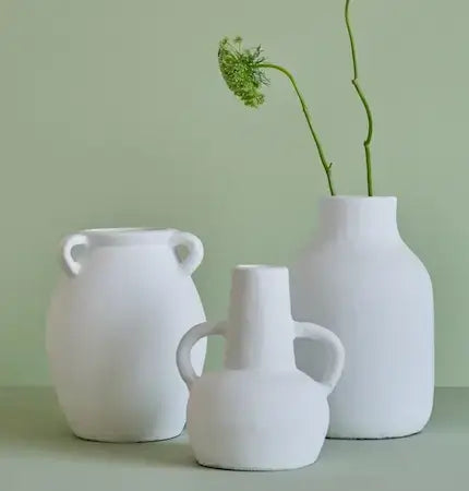 White ceramic vases with dried stems | Home and Soul Dubai