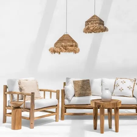 Wooden outdoor armchair and sofa with natural raffia pendant lights in Dubai home