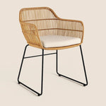 wicker dining chair with black legs with cushion