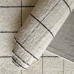 black and white checkered handwoven rug