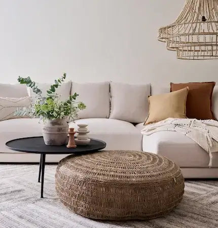 Modern Dubai living room with woolen rug - rattan furniture interior