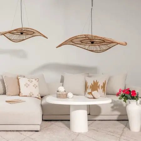 Rattan pendant lights above a neutral sofa - modern home lighting Dubai