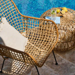 wicker lounge chair by the pool
