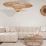  White modular sofa with rattan ceiling light and woven coffee table Dubai